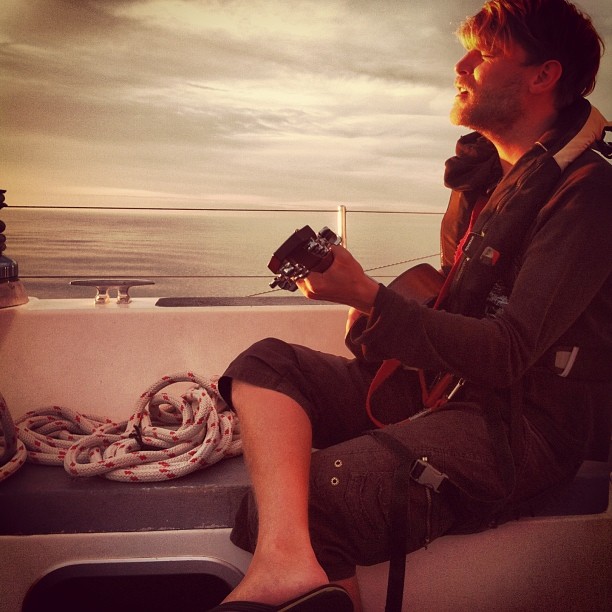 Maddie's photo of Andrew Murgatroyd jamming into the sunset.